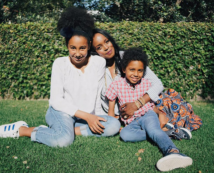 Nyakio Kamoche Grieco sitting outside with her children