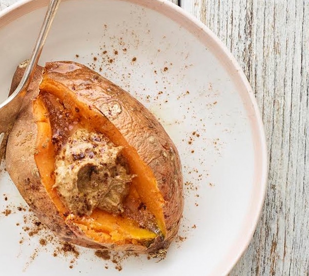 breakfast sweet potatoes topped with almond butter